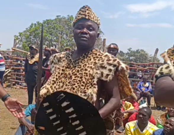 Traditional regalia and a shield at the installation gathering
